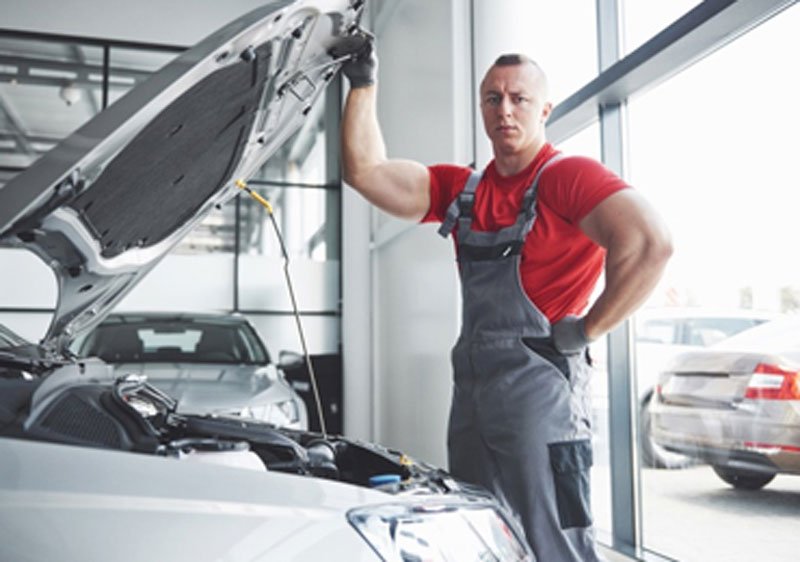 CF3 MOT mechanics working on vehicle
