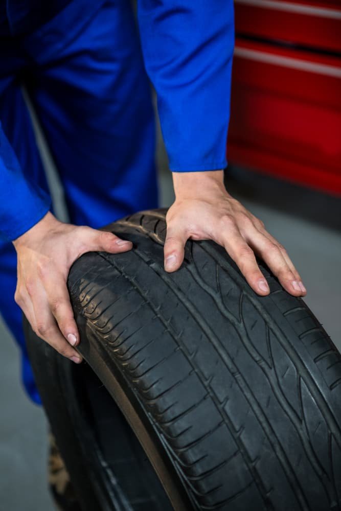 Checking tyre tread depth at CF3 MOT Service Centre Cardiff